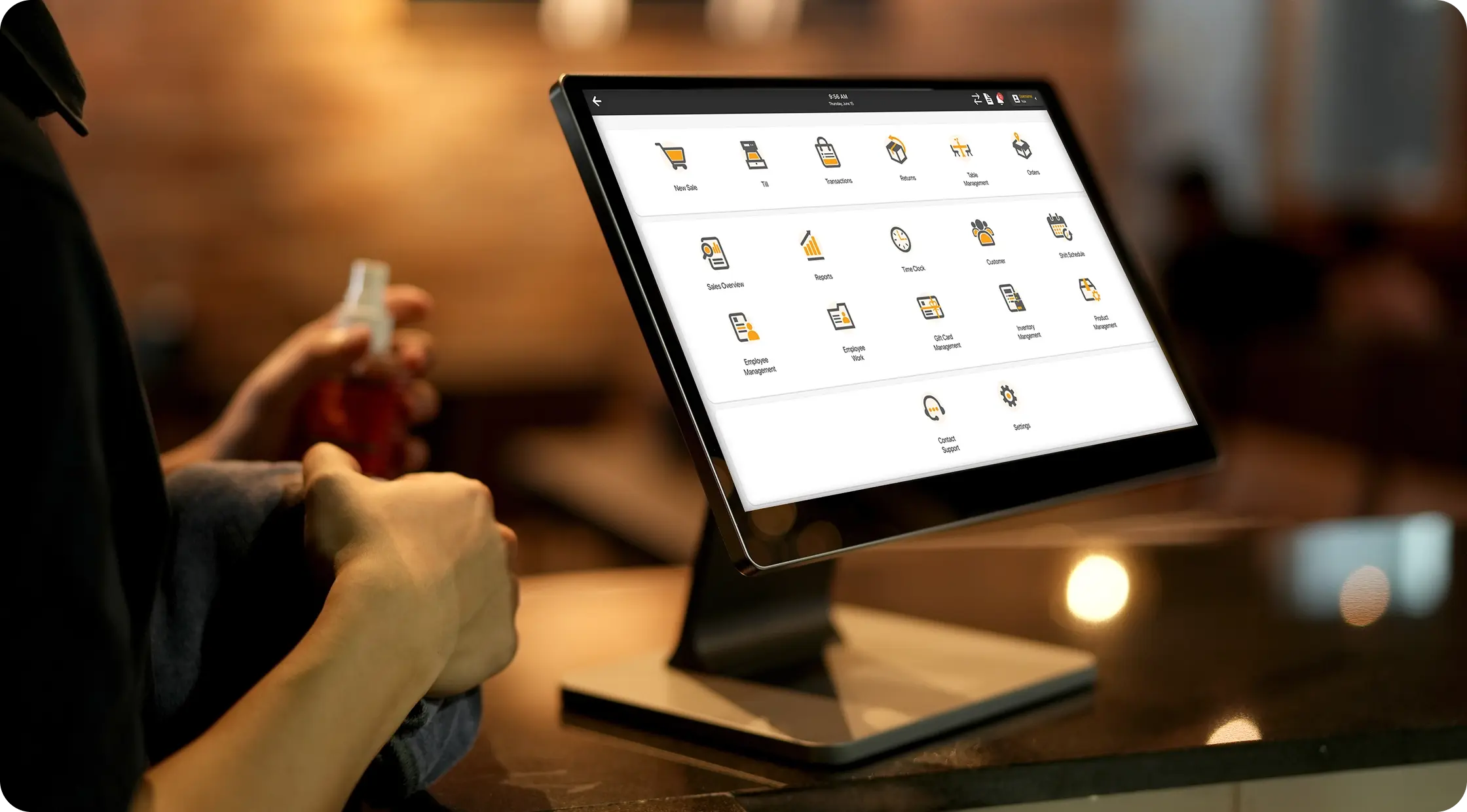 Cliqbux POS software dashboard in use at a restaurant counter
